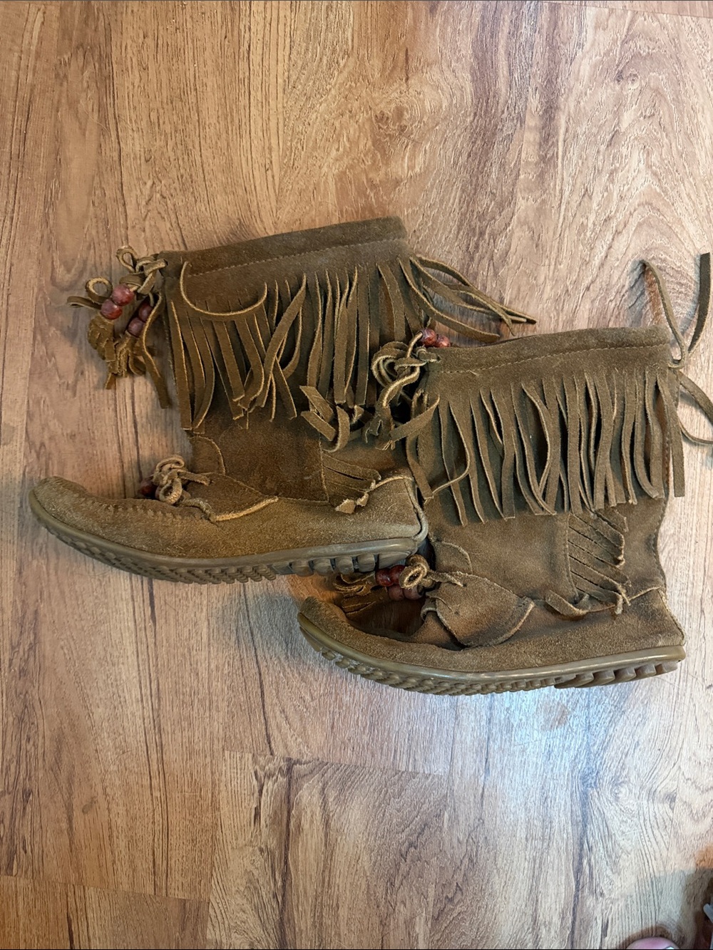Minnetonka Suede Fringe Moccasin Boots in Brown